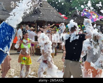 Golden Sands, Bulgaria - July 30, 2022: foam party on the beach, people have fun and dance in the foam Stock Photo