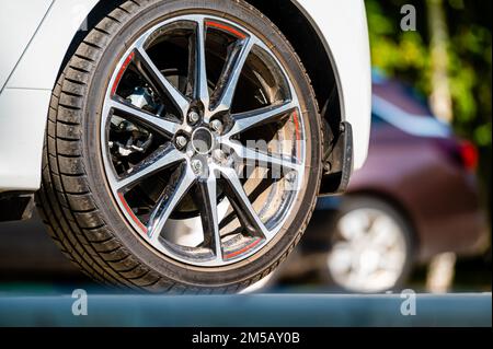 sports car wheels, low profile tires on aluminum rims, close-up, selective focus Stock Photo