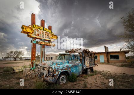An old truck sits in front of the abandoned Ranch House Cafe on historic Route 66 in Tucumcari, New Mexico. Stock Photo