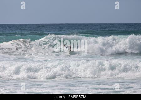 Padstow, Cornwall united kingdom September, 06 2012 Surfer riding on surfboard on ocean wave. Professional surfing in ocean on waves Stock Photo