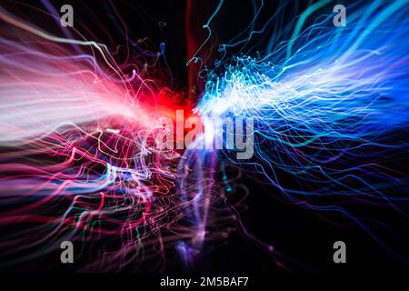 Red and blue light wave of energy with elegant glowing lines. Abstract technology background. Stock Photo