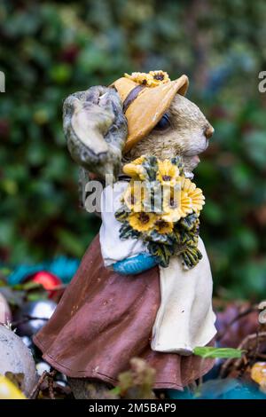 Female mouse with a vintage dress and sunflowers Stock Photo