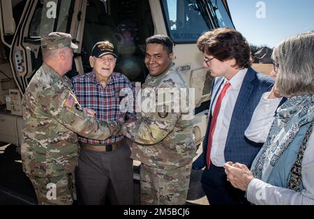 Dallas Texas -- Texas National Guardsman from 36th Sustainment Brigade do their part in granting the wish of 101 year-old WWII veteran, Jim Niederer, with a ride along in a military truck, Saturday Feb. 19, 2022. Mr. Niederer is a well decorated WWII Soldier from the 36th Infantry Division; surviving beach invasions, German Shelling and liberating concentration camps. He ran supplies to the front lines in six-by-six trucks and his wish was to ride in a military truck one more time. Stock Photo