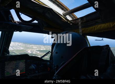 us air force b 52h stratofortress pilot 1st lt tanner devotie 96th expeditionary bomb squadron watches the lead aircraft of the formation prepare to land at andersen air force base guam following a bomber task force mission feb 21 2022 bomber task force deployments support national defense strategy objectives of strategic predictability and operational unpredictability through the speed flexibility and readiness of our strategic bombers 2m5bf4g