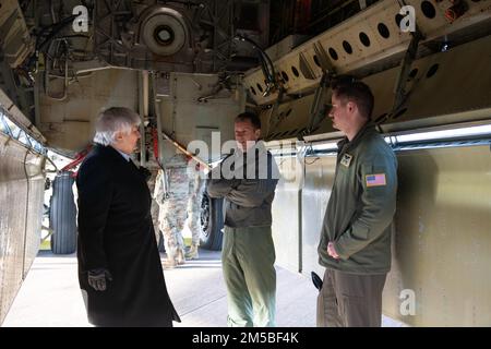 A U.S. Air Force B-52H Stratofortress pilot, right, assigned to the 69th Expeditionary Bomb Squadron, conducts a tour at RAF Fairford, England, Feb. 21, 2022. The tour was meant to give representatives from allied nations insights into the capabilities and operations of U.S. Air Forces in the United Kingdom. Stock Photo