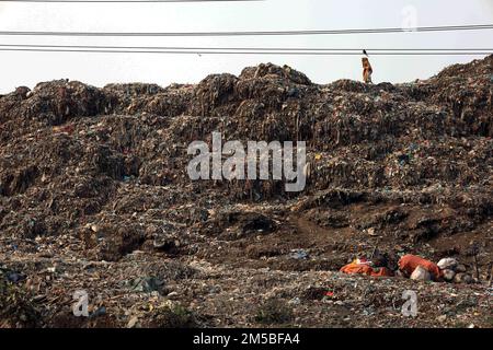 Gazipur, Gazipur, Bangladesh. 26th Dec, 2022. A pile of garbage like a mountain near Gazipur city. All the garbage of Gazipur City Corporation area is dumped here. Hundreds of tons of garbage are dumped every day. These wastes are polluting the environment very badly. Methane gas released from these wastes is a big threat to the Ozone layer. (Credit Image: © Syed Mahabubul Kader/ZUMA Press Wire) Stock Photo