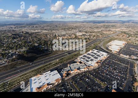 Santa Clarita, California, USA - December 6, 2022:  Aerial view of big box stores and the 14 freeway near Los Angeles in suburban Santa Clarita. Stock Photo