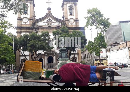 Rio de Janeiro, Brazil,June 13, 2022. Walking worker sleeping in downtown Rio de Janeiro. Stock Photo