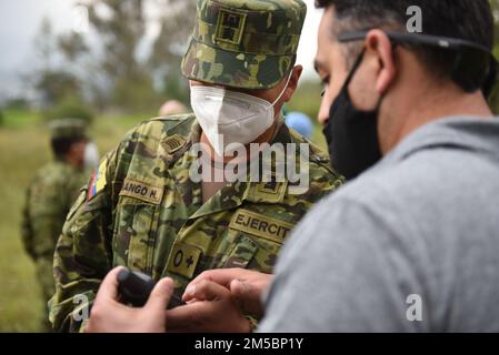 Tech Sgt. Oscar Morales, 7th Explosive Ordnance Disposal Flight, provides field training to Ecuadorian Army soldiers to use new demining equipment on Feb. 23, 2022, in Sangolquí, Ecuador. The equipment, from U.S. Southern Command, will be used to help clear the last remaining part of the country's southern border so it can be returned to the local population for farming and other activities. Stock Photo