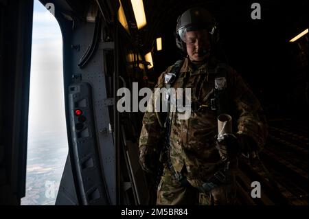 Master Sgt. Gary West, 14th Airlift Squadron loadmaster, prepares for an airdrop North Air Field, North, South Carolina, Feb. 24, 2022. Airlift squadrons conduct training such as these consistently to maintain readiness. (U.S. Air Force video by Staff Sgt. Christian Sullivan) Stock Photo