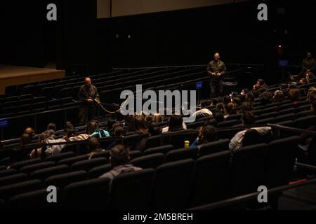 U.S. Marine Corps Gen. David H. Berger, the 38th Commandant of the Marine Corps, and Sgt. Maj. Troy E. Black, the 19th Sergeant Major of the Marine Corps, give opening remarks during a town hall at Marine Corps Air Station Iwakuni, Japan, on Feb. 24, 2022. The commandant and sergeant major answered questions on matters concerning health care and overseas livelihood. Stock Photo