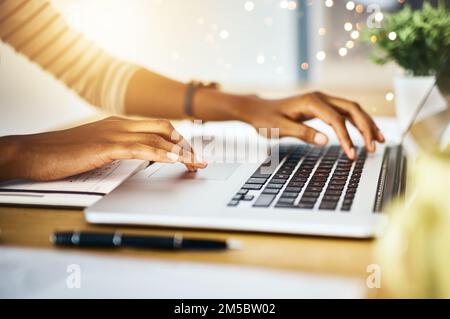 My fingers are typing machines. a unrecognizable persons hands typing on a laptop at home. Stock Photo