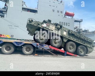 Soldiers with B Co, 4th Battalion, 23rd Infantry, 2nd Stryker Brigade Combat Team, 2nd Infantry Division, load their M1126 Stryker vehicles to be delivered to Fort Bhumibol Lopburi Artillery Centre February 20, 2022 in preparation for Exercise Cobra Gold 2022. Cobra Gold 2022 is the 41st iteration of the international training exercise that supports readiness and emphasizes coordination on civic action, humanitarian assistance, and disaster relief. From February 22 through March 4, 2022, this annual theater security event taking place at various locations throughout the Kingdom of Thailand inc Stock Photo