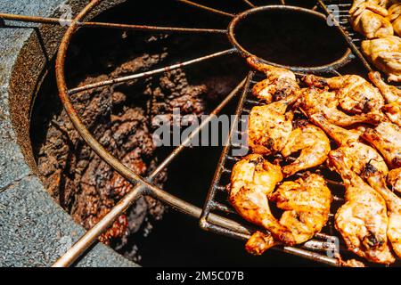 Tasty meat barbecued on volcanic heat, Timanfaya National Park, Canary Islands, Spain Stock Photo