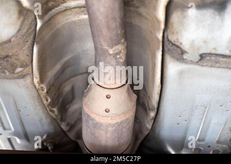 Exhaust pipe and catalyst system closeup view in the workshop Stock Photo