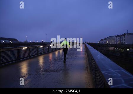 Germany, Berlin, 12. 01. 2022, Schwedter Steg in the rain, runners, joggers Stock Photo