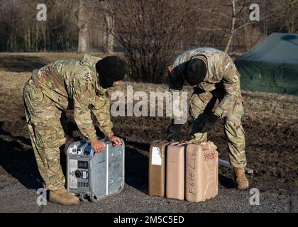Soldiers from 2nd Battalion, 34th Armored Regiment, 1st Armored Brigade Combat Team, 1st Infantry Division, collects fuel for a generator on Feb. 28, at Hradiště Military Area in Northwest Czech Republic. The 2/34th is preparing for two weeks of rigorous training as part of Saber Strike 22, a large scale, multi-national exercise taking place throughout Europe to enhance readiness and relationships between NATO allies in the U.S. Army Europe region. Stock Photo