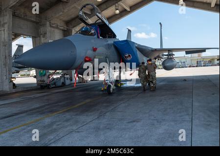 Airmen from the 44th Aircraft Maintenance Unit load AIM-9 Sidewinder ...