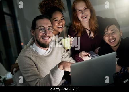 Were the design team you need. Portrait of a group of young designers working late in the office. Stock Photo
