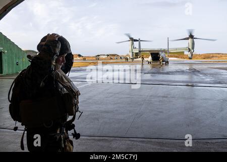 U.S. Navy Petty Officer 1st Class James S. Gafford with 2nd Marine Aircraft Wing, II Marine Expeditionary Force, puts on his helmet prior to boarding an MV-22B Osprey at Norwegian Air Force Base Bodø, Norway, Feb. 28, 2022. Exercise Cold Response ’22 is a biennial exercise that takes place across Norway, with participation from each of its military services, as well as from 26 additional North Atlantic Treaty Organization (NATO) allied nations and regional partners. Stock Photo