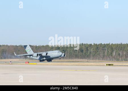 A U.S. Air Force C-17 aircraft from 7th Airlift Squadron, 62nd Airlift Wing, delivered a CH-47 Chinook helicopter which was received by U.S. Soldiers assigned to Delta Company, 1st Battalion, 214th Aviation Regiment, 12th Combat Aviation Brigade at Nuremberg, Germany, Feb. 28, 2022. As announced by Department of Defense, the U.S.-based 1st Armored Brigade Combat Team, 3rd Infantry Division is deploying to Europe and will be located at Grafenwoehr Training Area, where they will be issued equipment from Army Prepositioned Stocks-2, and conduct training. Stock Photo