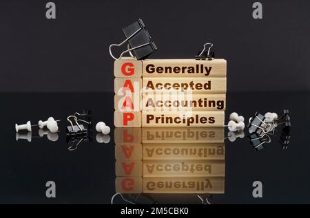 Business concept. On a black reflective surface, buttons, clips and wooden blocks with the inscription - Generally Accepted Accounting Principles Stock Photo