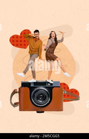 Vertical collage picture of two excited mini funny people dancing huge vintage photocamera show v-sign drawing hearts Stock Photo