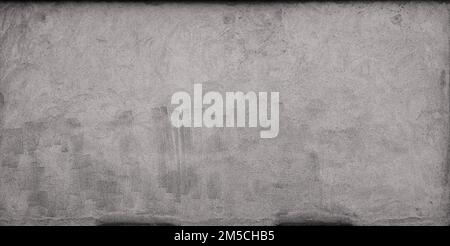 Front view of a plastered gray stone wall with stains from graffiti removal. Abstract high resolution full frame textured grunge background. Stock Photo