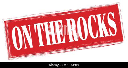 ON THE ROCKS text written on red trapeze stamp sign Stock Photo - Alamy
