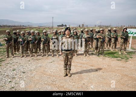 Maj. Muzhda, Peshmerga female battalion commander, introduces the battalion to members of the Joint Operation Command Advisor Team (JOCAT) in Sulaymaniyah, Iraq, Mar. 2, 2022.   JOCAT visited the female peshmerga battalion to bring awareness and advise them on possible improvements to the battalion. Stock Photo