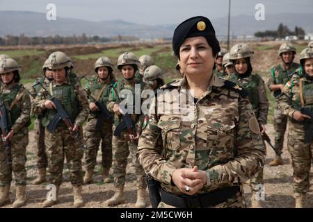 Maj. Muzhda, Peshmerga female battalion commander, introduces the battalion to members of the Joint Operation Command Advisor Team (JOCAT) in Sulaymaniyah, Iraq, Mar. 2, 2022. JOCAT visited the female peshmerga battalion to bring awareness and advise them on possible improvements to the battalion. Stock Photo