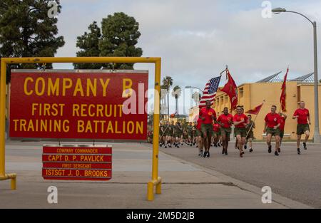 New U.S. Marines with Bravo Company, 1st Recruit Training Battalion, participate in a motivational run at Marine Corps Recruit Depot San Diego, Mar. 2, 2022. The staff of the Recruit Training Regiment ran at the front of the formation wearing red shirts to represent the battalion they lead. Stock Photo