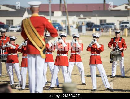 U.S. Marines with 'The Commandant's Own' Marine Drum & Bugle Corps conduct a final dress rehearsal at Marine Corps Air Station Yuma, Arizona, Mar. 3, 2022. The Battle Color Detachment annually visits Yuma for its ideal weather during this season to begin training for their upcoming performances. For the past month the Marines have been training to perfect their drill and continue the tradition of ceremonial excellence. Stock Photo