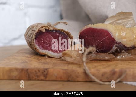 Close-up homemade duck jamon, homemade snack, jerky on board, selective focus Stock Photo