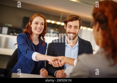 Joining forces for profit. two businesswomen shaking hands during a meeting at work. Stock Photo