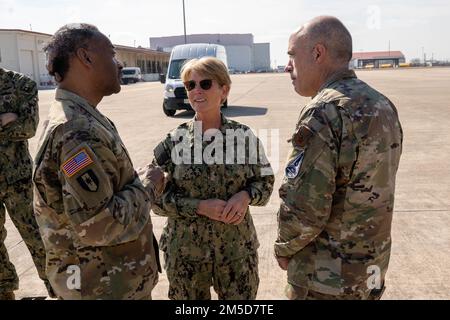 JOINT BASE SAN ANTONIO -- LACKLAND, Texas (Mar. 3, 2022) Rear Adm. Cynthia Kuehner, commander of Naval Medical Forces Support Command, talks with senior medical representatives from the other services during a tour of U.S. Transportation Command’s (USTRANSCOM) exercise operations area at Ultimate Caduceus 2022 (UC22). The USTRANSCOM-led annual patient movement field training exercise is designed to simulate bringing injured troops from outside the continental U.S. to advanced care centers stateside. Rear Adm. Cynthia Kuehner, commander of Naval Medical Forces Support Command, and Command Maste Stock Photo