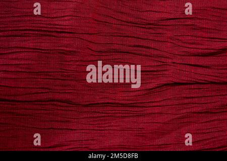 Red fabric background texture pattern. Red fabric cloth textile background. Stock Photo