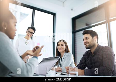 They always produce impressive work together. businesspeople having a discussion in an office. Stock Photo