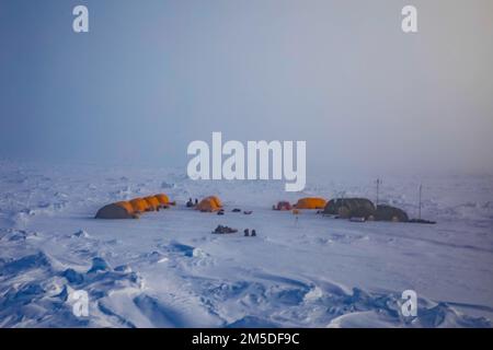 220304-N-ON977-1082 BEAUFORT SEA, Arctic Circle (March 4, 2022) – Ice Camp Queenfish during Ice Exercise (ICEX) 2022. ICEX 2022 is a three-week exercise that allows the Navy to assess its operational readiness in the Arctic, increase experience in the region, advance understanding of the Arctic environment, and continue to develop relationships with other services, allies, and partner organizations. Stock Photo