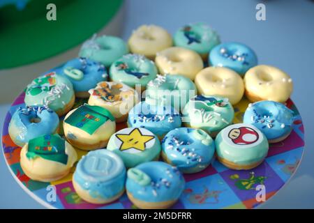 super Mario Bros Birthday party catering, snacks, mini doughnuts. Mario's Birthday party. Stock Photo