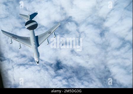 An E-3 Sentry from the 961st Airborne Air Control Squadron, Kadena Air Base, Japan, departs from a KC-135 Stratotanker assigned to the 117th Air Refueling Squadron, Forbes Field Air National Guard Base, Kansas, after receiving fuel over the Indo-Pacific region, March 4, 2022. Pacific Air Forces utilize various aircraft to maintain a flexible theater posture to enhance its ability to provide the Department of Defense options to support our allies and partners in a free and open Indo-Pacific theater. Stock Photo