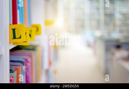 Books with alphabet letters classification in library Stock Photo - Alamy