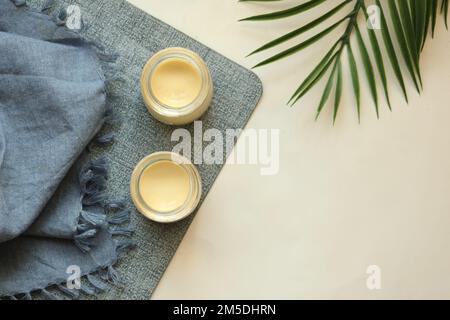 Caramel pudding in a glass jar on table  Stock Photo