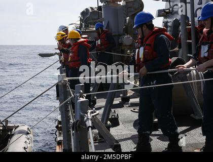 ATLANTIC OCEAN (Mar. 5, 2022) – Deck department Sailors practice launching the rigid hulled inflatable boat (RHIB) while aboard the Arleigh Burke-class guided-missile destroyer USS Porter (DDG 78, Mar. 5, 2022. Porter, forward-deployed to Rota, Spain, is currently underway in the U.S. Sixth Fleet area of operations in support of regional allies and partners and U.S. national security interests in Europe and Africa. Stock Photo