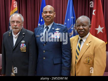 Brig. Gen. Edward H. Evans, Jr., chief of staff, Mississippi Air National Guard, shares a moment with Maj. (Ret.) Clarence “Clyde” Romero (left), the first African American Mississippi Air National Guard pilot for the 186th Air Refueling Wing, Meridian, Mississippi, and Capt. (Ret.) Brady Tonth, Jr (right), the first African American Mississippi Air National Guard pilot for the 172nd Airlift Wing, Jackson, Mississippi, following his promotion ceremony at Mississippi National Guard Joint Force Headquarters, Jackson, Mississippi, March 5, 2022. Evans is the first African American Mississippi Air Stock Photo