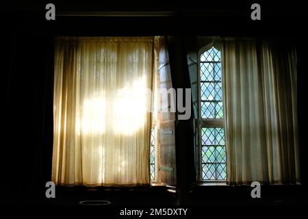 Sun shining through a medieval window - John Gollop Stock Photo