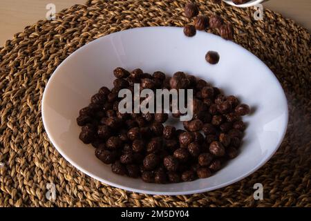 photo of a quick breakfast of chocolate cereal balls Stock Photo