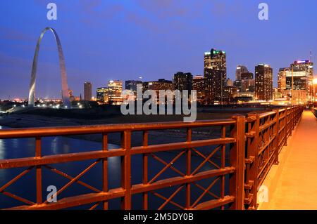 The skyline of St Louis at night as seen from the Eads Bridge freatures the Gateway Arch Stock Photo