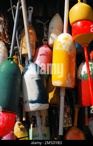 Colorful lobster trap buoys are on display at a seafood restaurant in New England Stock Photo