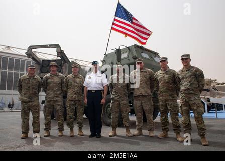 U.S. Army Maj. Gen. Wendul Hagler, United States Army Central deputy commanding general, poses with U.S. Army 3rd Battalion, 157th Field Artillery Regimen Soldiers in front of the U.S. M142 High Mobility Artillery Rocket System on display at the World Defense Show in Riyadh, Kingdom of Saudi Arabia, March 6, 2022. HIMARS is a wheeled, precision strike weapons system that provides close and long-range precision rocket and missile fire support to combat forces. U.S. participation at the World Defense Show builds upon our strong relationship with the Kingdom of Saudi Arabia and enhances our relat Stock Photo